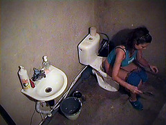 Sexy girl spied pissing on the toilet